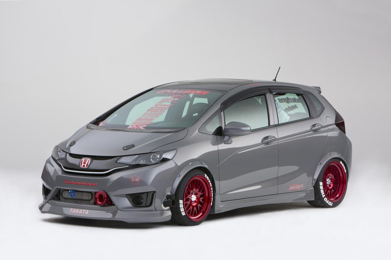 Illustration for article titled A Honda Fit With A Grom In The Back Is Something We Need Yesterday